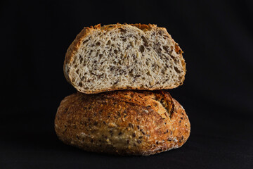 Whole wheat bread on black background