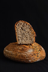 Whole wheat bread on black background