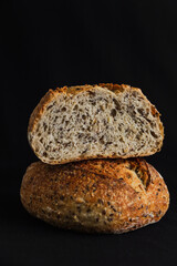 Whole wheat bread on black background
