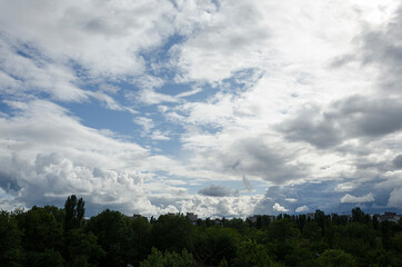 Obraz na płótnie Canvas Beautiful summer sky before rain.Blue sky and white heavy clouds as a background