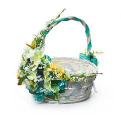 Festive basket with a flower arrangement on white background