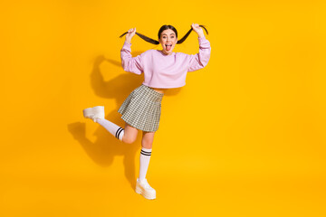 Full length body size view of her she nice attractive lovely comic cheerful cheery girl having fun fooling grimacing isolated over bright vivid shine vibrant yellow color background