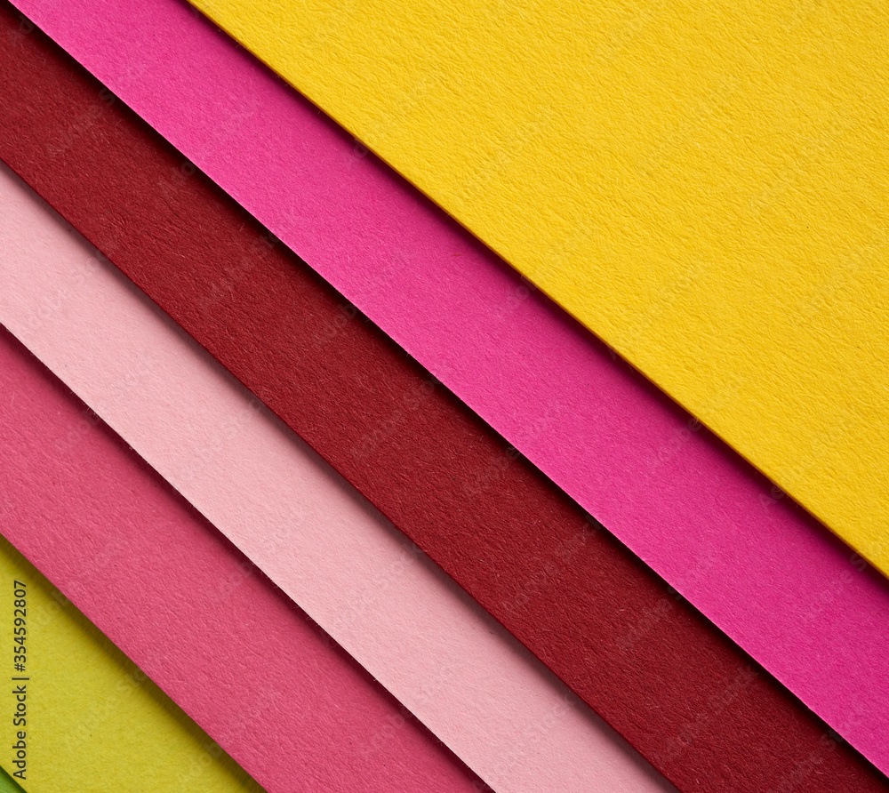 Poster multi-colored cardboard folded in layers with a shadow, abstract creative backdrop