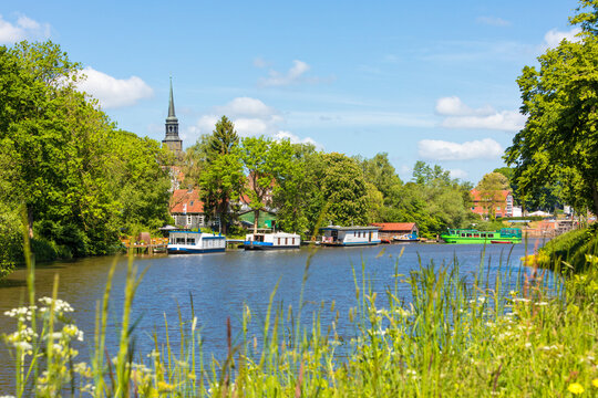 Burggraben at Stade with houseboats and belltower of St Cosmae church in background