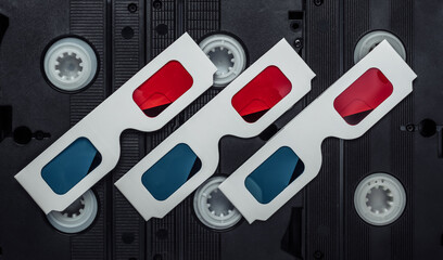 Retro 80s paper stereo 3D glasses on video cassette. Top view