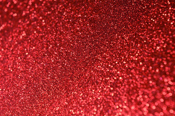 Hot red shine glitter background. Selective focus. Beautiful scarlet sparkle abstraction. Glamour...