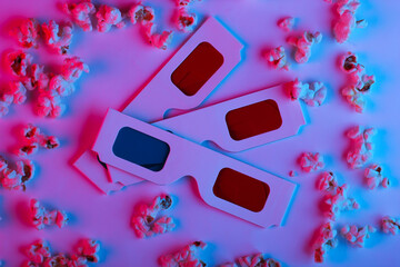 Movie time. Stereoscopic anaglyph disposable paper 3d glasses with popcorn in pink blue gradient...