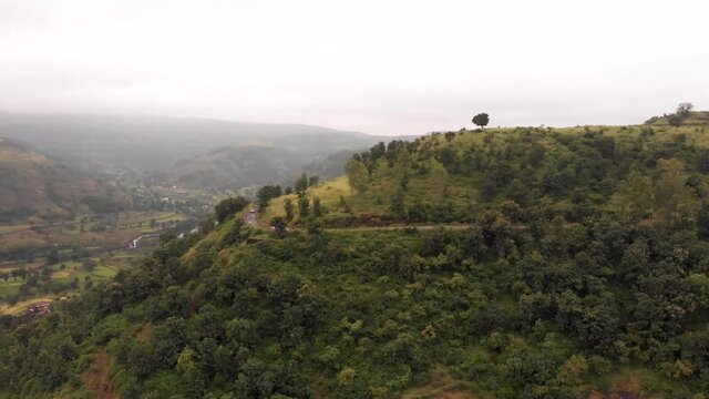 Aerial drone view of road and hill towards Bhimashankar, Maharashtra, India.