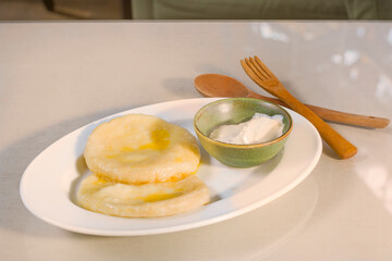 Potatoes dumpling with souse on the plate , ready to eat.