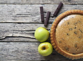 Homemade Apple pie on a rustic wooden background. A classic dessert made of dough for any holiday.