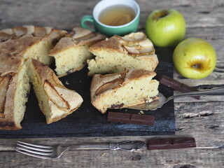 Homemade Apple pie on a rustic wooden background. A classic dessert made of dough for any holiday.