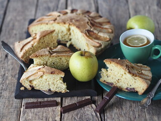 Homemade Apple pie on a rustic wooden background. A classic dessert made of dough for any holiday.