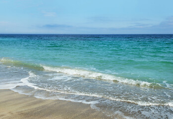 Wave of the sea. Surf and sand on beach on Black Sea