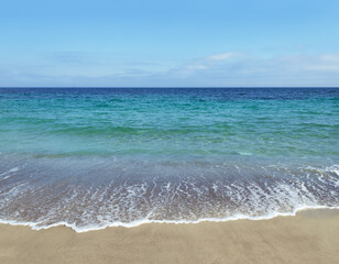Fototapeta na wymiar Surf and sand on beach on Black Sea