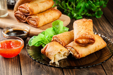 Spring rolls with chicken and vegetables served with sweet chili sauce or soy sauce