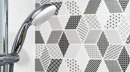 Shower without running water in the new bathroom with European renovation close-up.