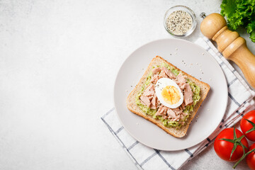Avocado toast with tuna and boiled egg.
