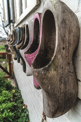 Clogs hanging on a wall outside a clog factory in Amsterdam the Netherlands