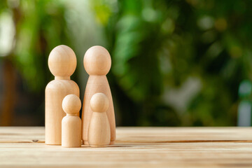 Wooden little figures of people. Family concept
