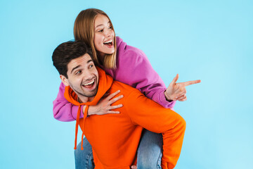 Fototapeta premium Portrait of a young couple wearing hoodies