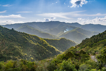 the serene view of greenery hills in the valley of Kampung Kiau, Bundu Tuhan