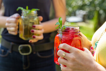 natural juices in the decorative mug and beautiful scenery with good friends