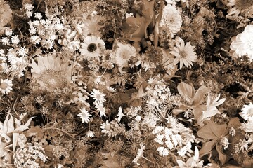 Flower composition at a market. Sepia toned vintage filter photo.