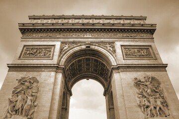 Fototapeta na wymiar Paris Triumphal Arch. Sepia toned vintage filter photo.