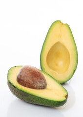Healthy lifestyle concept. Avocado cut half isolated on white background.