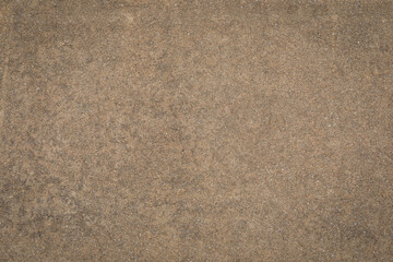 Fototapeta premium Background vignette in dark tan khaki brown concrete texture, creative copy space, horizontal aspect