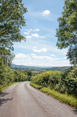 Country road looking into the Brecon beacons from Brilley hill, United Kingdom