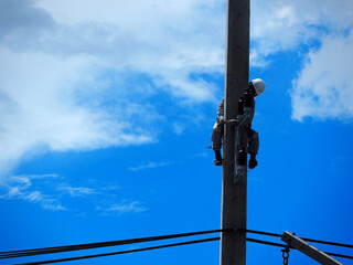 Fototapeta premium electrician man working at height and dangerous ,high voltage power line maintenance