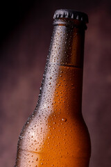 Cold bottle of beer with water droplets