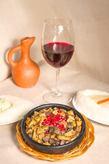Kuchmachi, Georgian traditional food with meat, walnuts, pomegranates and onion.