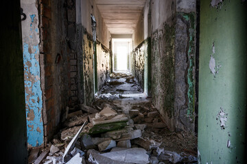 Fototapeta na wymiar Long corridor of ruined abandoned house