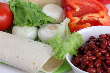 Food ingredients for tacos on the kitchen table