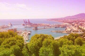 Malaga city seaport. Vintage filter toned color image.