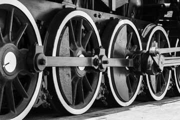 Wheels of vintage steam locomotive with power parts