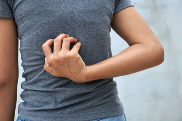 Backside of white woman back pain and ache concept,Itchy Asian woman in the back