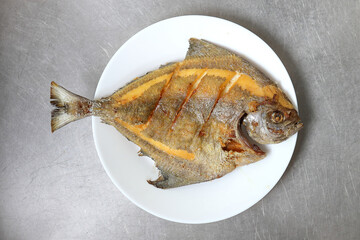 Deep fried snapper fish in the plate.
