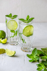 Two glasses of mojito. Making Mojito Cocktail At Home.