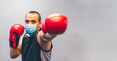 Latin boxer with mask and red gloves