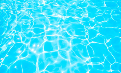 Fototapeta na wymiar Blue water texture in swimming pool