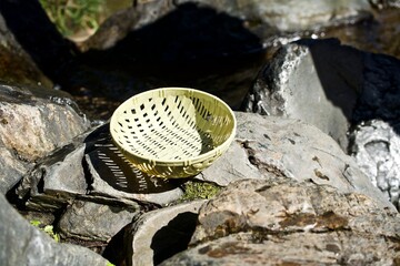 The small basket on the rock in Japan.