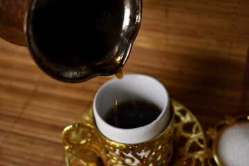 hot coffee poured into a cup