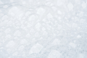 Bubble foam soap shampoo on water close up