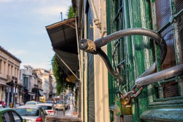 Wooden Geeek Tavern door closed with a padlock during the covid 19 lockdown in Athens, Greece.