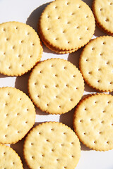 Sandwich cookies on white background. Trendy minimal food. Simple bakery, top view