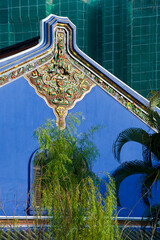 blue wall with decorations of broken pieces of porcelain on The Blue Mansion in George Town, Penang,  Malaysia
