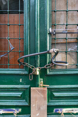 Wooden Geeek Tavern door closed with a padlock during the covid 19 lockdown in Athens, Greece.